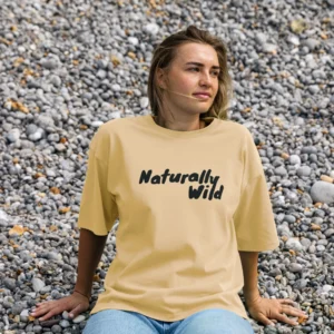 woman wearing butter yellow tshirt with type Naturally Wild, designed by Lumimango